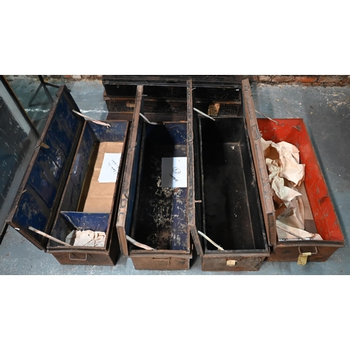 562 - A stack of four assorted japanned steel military uniform trunks, variously labelled incl. J. Roberts... 