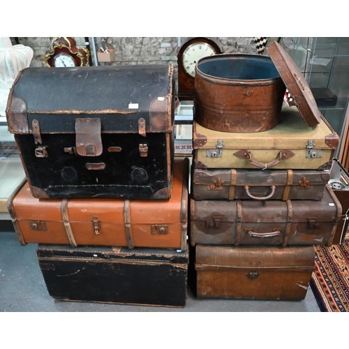 563 - Various assorted vintage leather, canvas and fabric clad wood luggage trunks, suit cases and a large... 