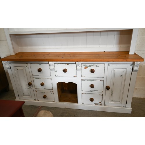 49A - A substantial part-painted pine kitchen dresser with open plate rack with two shelves on base with d... 