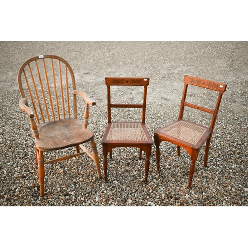 151 - A pair of late Victorian Aesthetic movement pitch pine side chairs with marquetry inlays, caned seat... 