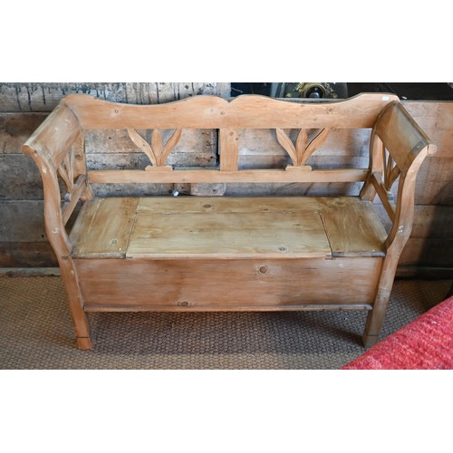 192 - A Continental stropped pine box seated settle/hall bench, 127 cm w x 42 cm x 90 cm h