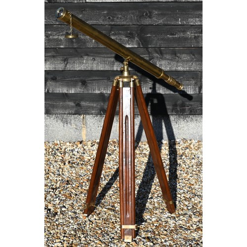 358 - A reproduction brass telescope, 100 cm long, on adjustable wooden tripod