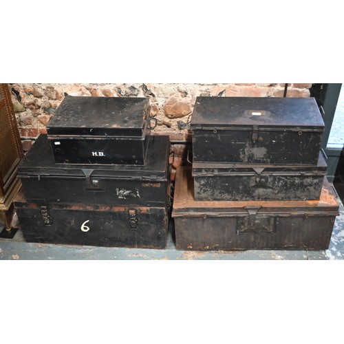 564 - Six assorted antique and later black japanned steel military and other uniform trunks, variously lab... 