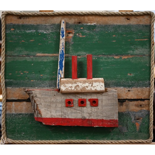 250A - A three dimensional painted driftwood boat, on board, 59 x 51 cm