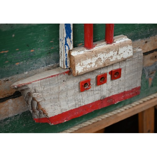 250A - A three dimensional painted driftwood boat, on board, 59 x 51 cm