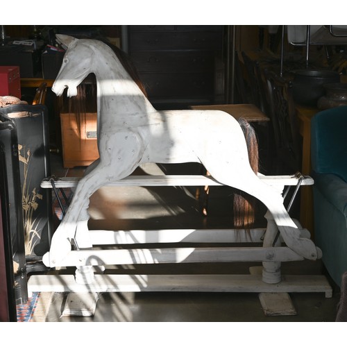 144 - A painted wooden rocking horse on swing stand with turned supports, 140 cm wide x 124 cm high