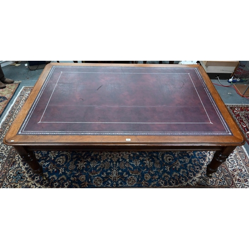 913 - A 19th century mahogany library table, the silver tooled burgundy leather inset top over a pair of f... 