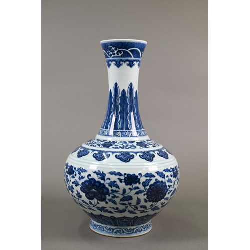 A Chinese blue and white 'lotus scroll' vase with six-character seal script Jiaqing mark but probably later, painted in tones of underglaze blue with meandering stylised floral scroll and decorative key-fret, ruyi and lappet banding with crashing waves at the rim, 38 cm high 