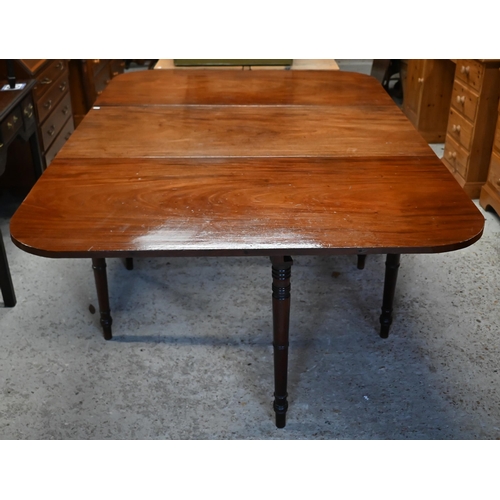 49 - WITHDRAWN A Georgian mahogany drop leaf supper table, the wide leaves raised on a turned gateleg fra... 