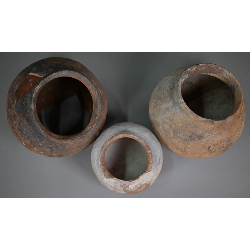 409 - A Mexican earthenware replica Colima Dog ritualistic ewer, 29 cm long (cracked beneath) to/w a 29.5 ... 