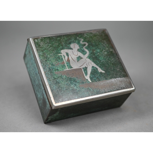 435 - WMF, Germany - a 1930s cigarette box with fired patination finish featuring silhouette of lady smoki... 