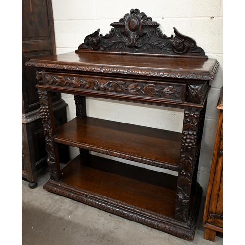 132 - A late Victorian Irish carved oak buffet with raised back, single drawer and open shelves, 120 x 52 ... 