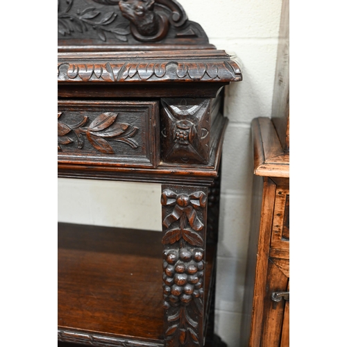 132 - A late Victorian Irish carved oak buffet with raised back, single drawer and open shelves, 120 x 52 ... 