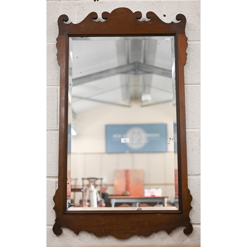 139 - A 19th century bevelled wall mirror in fret-cut walnut frame, 65 cm wide x 114 cm high