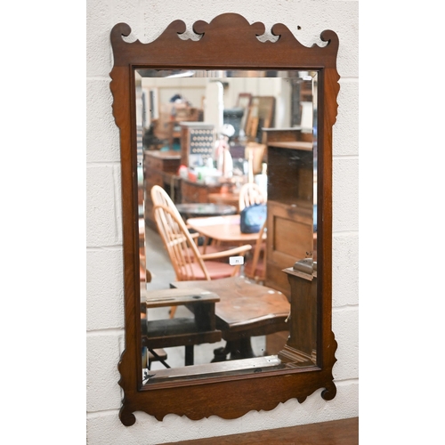 139 - A 19th century bevelled wall mirror in fret-cut walnut frame, 65 cm wide x 114 cm high