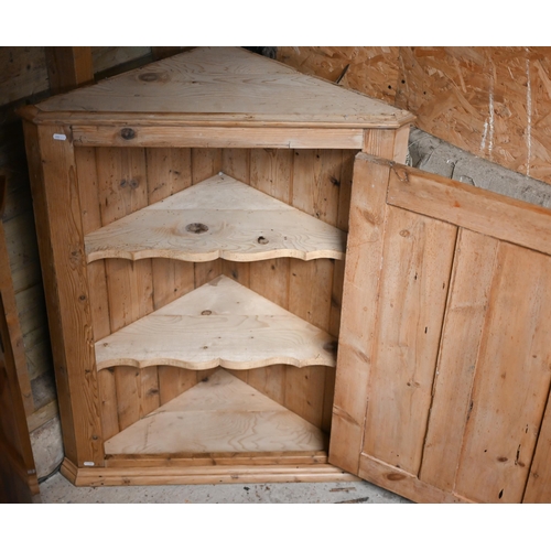 103 - A Victorian stripped pine hanging corner cupboard