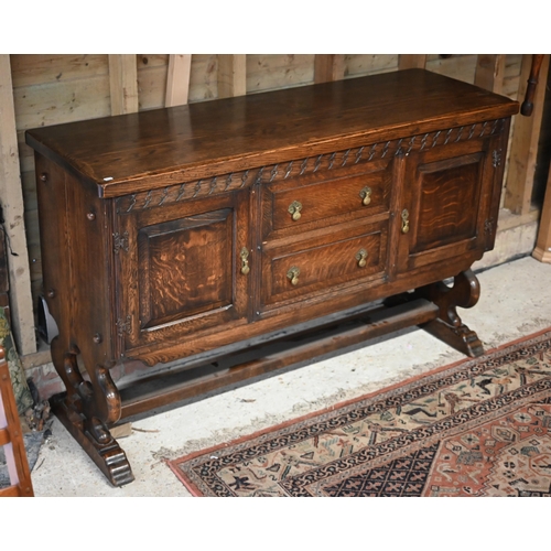 105 - An oak sideboard centred with two drawers flanked by cupboards, circa 1930s, 153 cm x 51 cm x 95 cm ... 