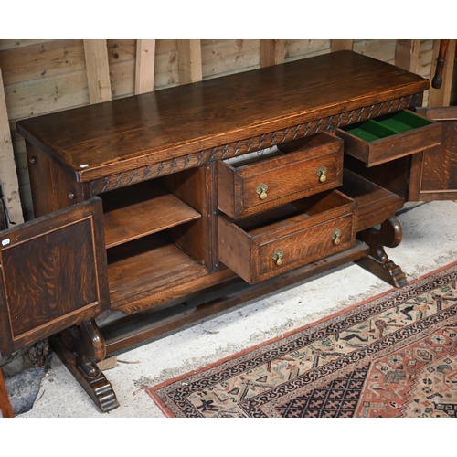 105 - An oak sideboard centred with two drawers flanked by cupboards, circa 1930s, 153 cm x 51 cm x 95 cm ... 