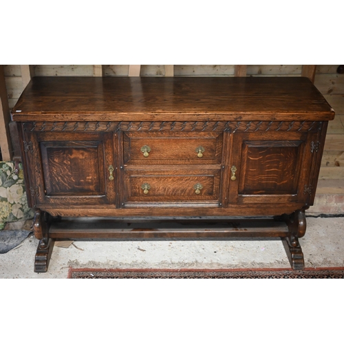 105 - An oak sideboard centred with two drawers flanked by cupboards, circa 1930s, 153 cm x 51 cm x 95 cm ... 