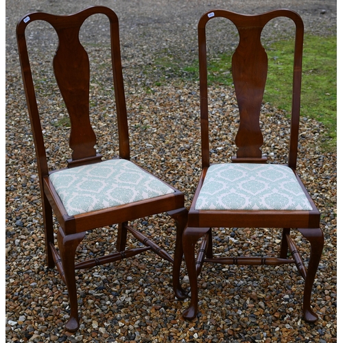 107 - A set of four Georgian style dining side chairs, with 'vase' shaped backrests and fabric seat pads (... 