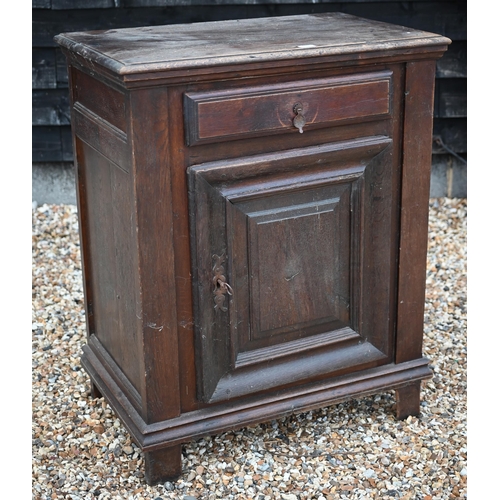 108 - An 18th century Italian walnut side cabinet, with frieze drawer over a mitre framed door, raised on ... 