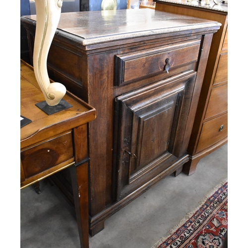 108 - An 18th century Italian walnut side cabinet, with frieze drawer over a mitre framed door, raised on ... 