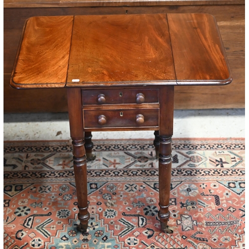 11 - A Victorian mahogany drop leaf work table, with two drawers to one end opposing dummy drawer fronts,... 