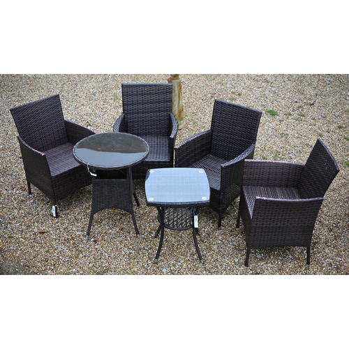 114 - A modern synthetic rattan garden terrace set comprising four armchairs, a circular table and a small... 