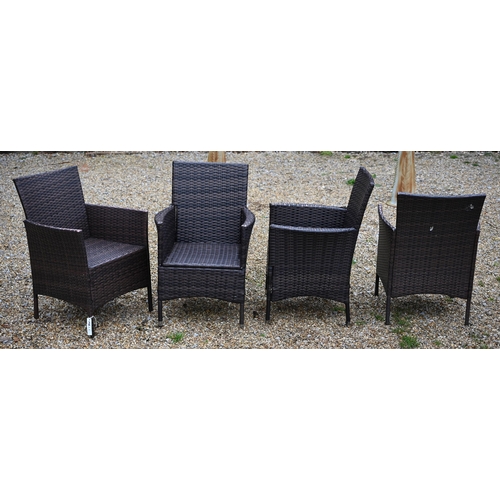 114 - A modern synthetic rattan garden terrace set comprising four armchairs, a circular table and a small... 