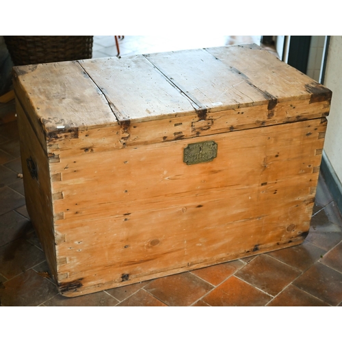 120 - An early 20th century large pine carpenter's tool chest with hinged top enclosing the compartmentali... 