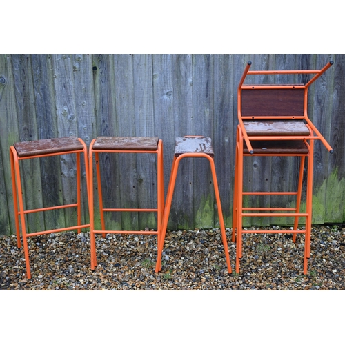 122 - Six vintage stacking school laboratory stools with hardwood seats and orange metal tubular frames