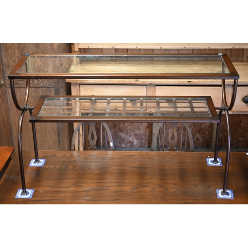 13 - A copper patinated two tier glass top coffee table, 120 cm x 40 cm x 73 cm h