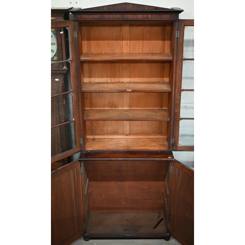 145 - A mid 19th century mahogany bookcase cabinet with two door glazed top on two door cabinet base with ... 