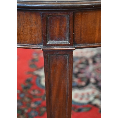 182 - An early 20th century mahogany extending wind-out action dining table, the rounded top with four lea... 