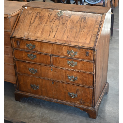 184 - A Georgian walnut fall front-bureau with fitted interior over dummy drawer, two short and two long d... 