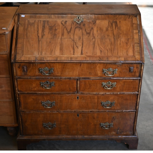 184 - A Georgian walnut fall front-bureau with fitted interior over dummy drawer, two short and two long d... 