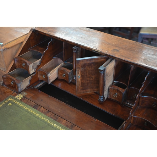 184 - A Georgian walnut fall front-bureau with fitted interior over dummy drawer, two short and two long d... 