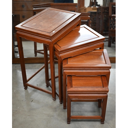 192 - A nest of four 20th century Chinese hardwood tables, the largest 50 cm wide x 35 cm deep x 66 cm hig... 