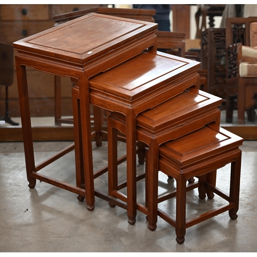 192 - A nest of four 20th century Chinese hardwood tables, the largest 50 cm wide x 35 cm deep x 66 cm hig... 