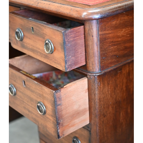 194 - A late Victorian mahogany twin-pedestal desk with gilt-tooled red leather top over nine drawers, 120... 