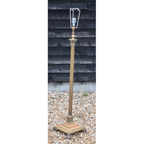 198 - An adjustable brass classical column standard lamp on stepped square platform base with paw feet