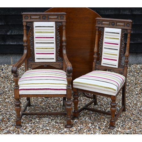 199 - A set of eight carved oak dining chairs with striped fabric upholstery, comprising two carvers and s... 