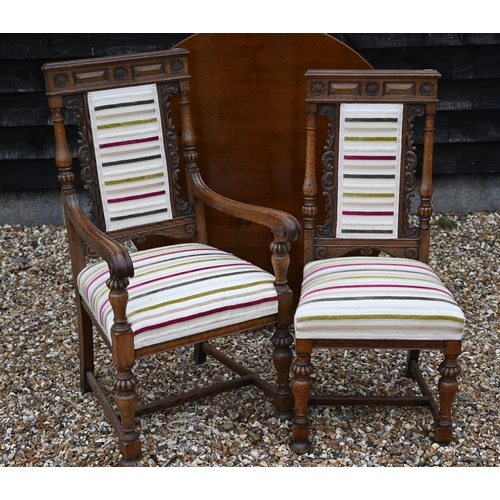 199 - A set of eight carved oak dining chairs with striped fabric upholstery, comprising two carvers and s... 