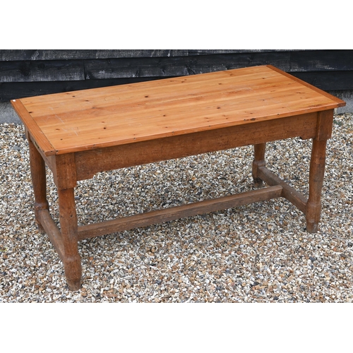 200 - A pine farmhouse kitchen dining table with cleated rectangular top on turned supports, 154 x 74 x 76... 