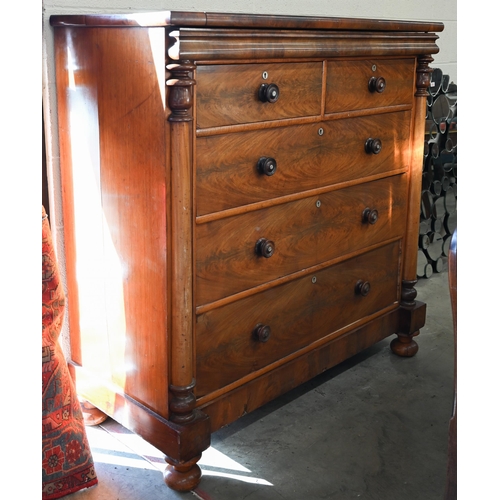 202 - A large Victorian country house figured mahogany chest with shallow cavetto drawer over two short an... 