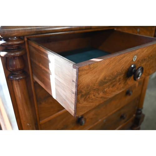 202 - A large Victorian country house figured mahogany chest with shallow cavetto drawer over two short an... 