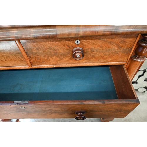 202 - A large Victorian country house figured mahogany chest with shallow cavetto drawer over two short an... 