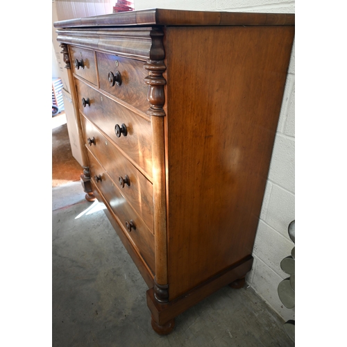 202 - A large Victorian country house figured mahogany chest with shallow cavetto drawer over two short an... 