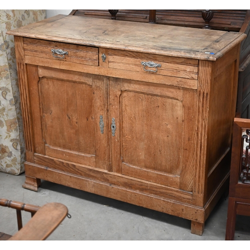 205 - An antique provincial oak dresser base with two drawers over panelled cupboardsmissing one bracket f... 