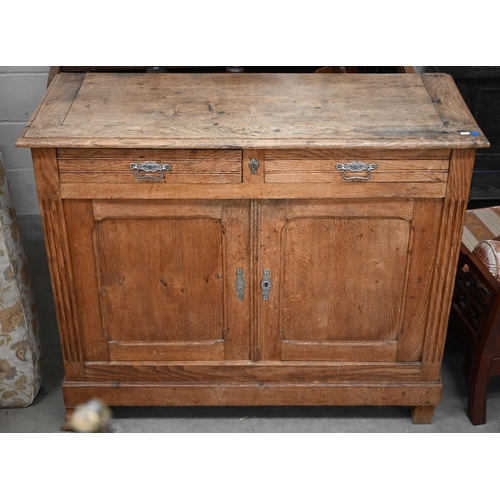 205 - An antique provincial oak dresser base with two drawers over panelled cupboardsmissing one bracket f... 